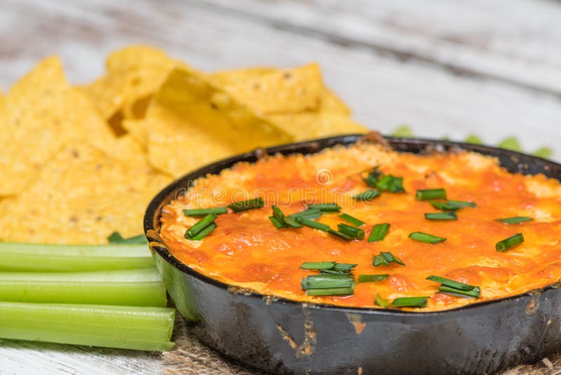 Buffalo Chicken Dip with Chps and Celery Stock Photo - Image of chives ...