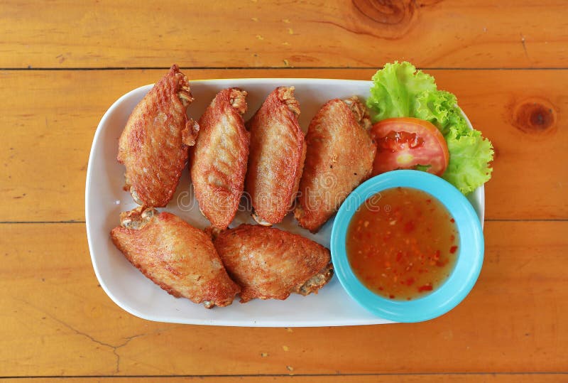 Buffalo Chicken Wings with Sticky Rice on White Plate Stock Photo