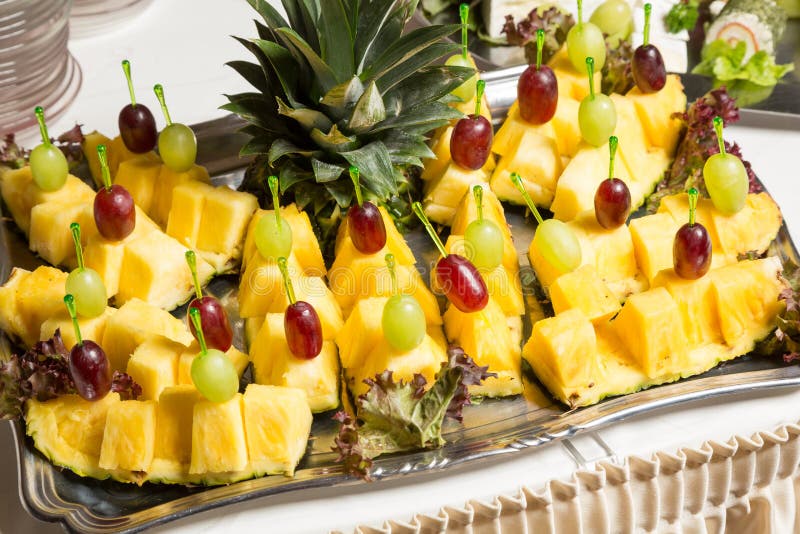 Buffet with Pineapple and Grapes Appetizers and Other Fruits in
