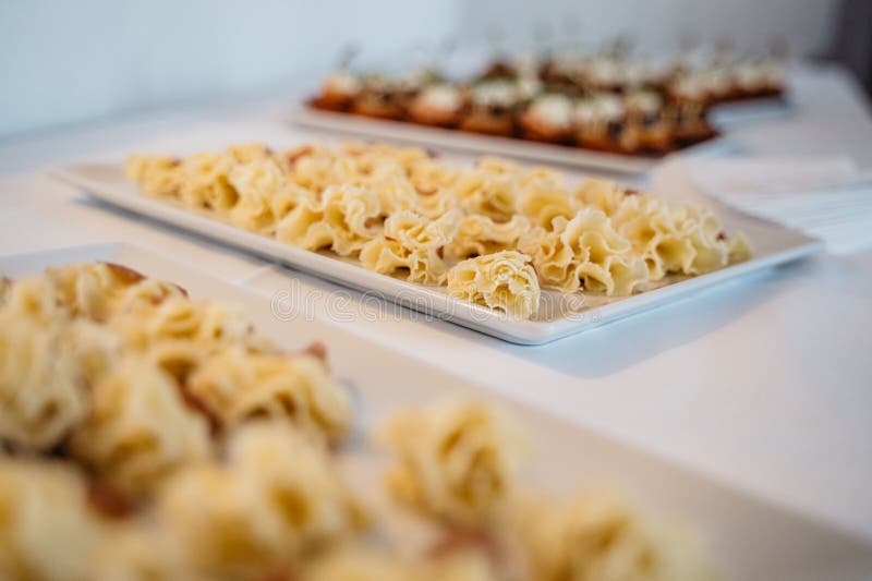 Buffet table with delicate pastries stock images