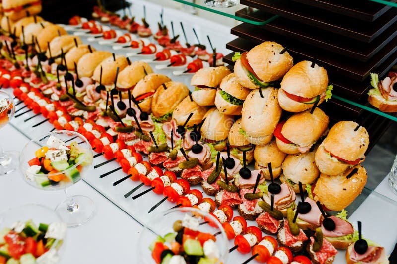 Buffet Table of Reception with Burgers, Cold Snacks, Meat and Sa Stock