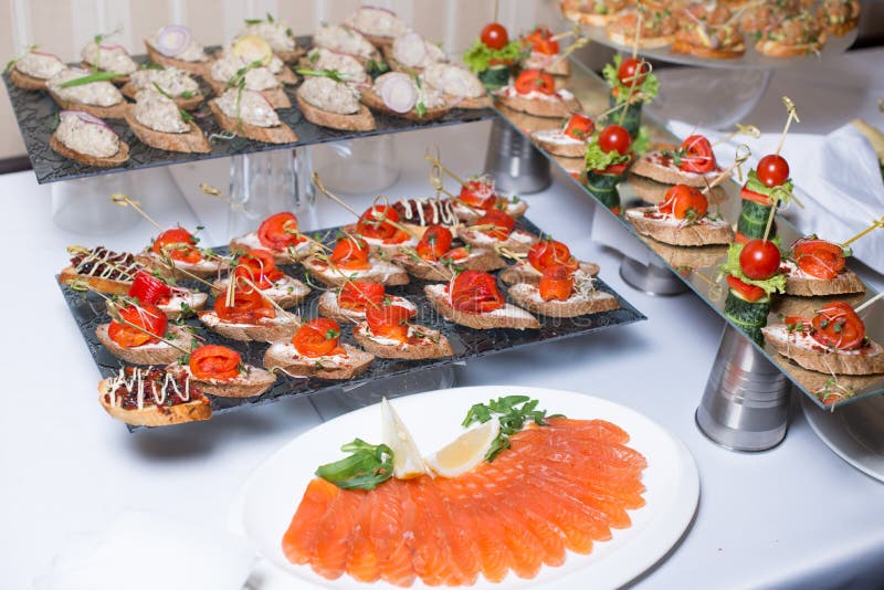 Buffet Table of Reception with Burgers, Cold Snacks, Meat and Salads