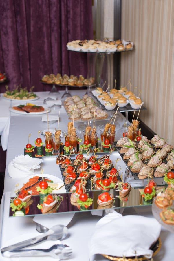 Buffet Table of Reception with Burgers, Cold Snacks, Meat and Salads ...