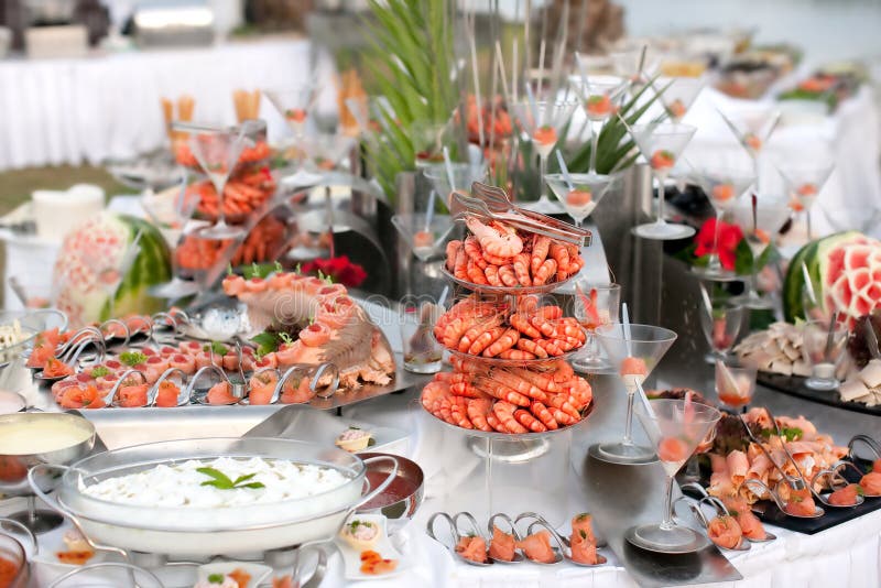 Buffet table with seafood with shrimp in the foreground