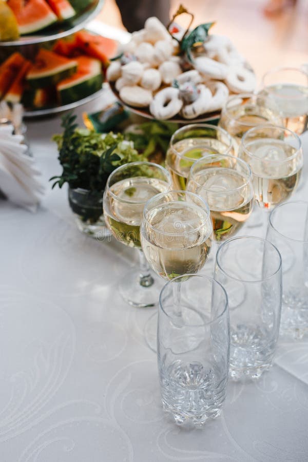 Buffet table with wine and juice, fruits and sweets, snacks and mint ice royalty free stock photography