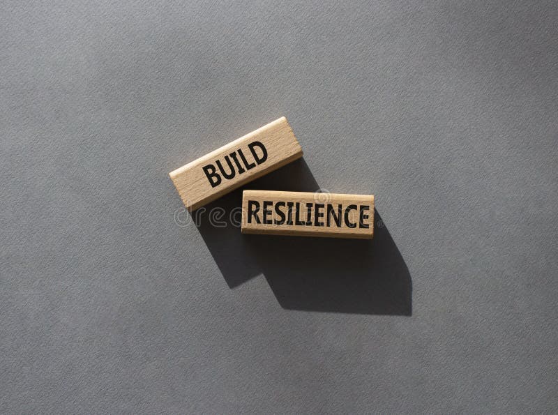 Build resilience symbol. Wooden blocks with words Build resilience. Beautiful grey background. Business and Build resilience stock photography