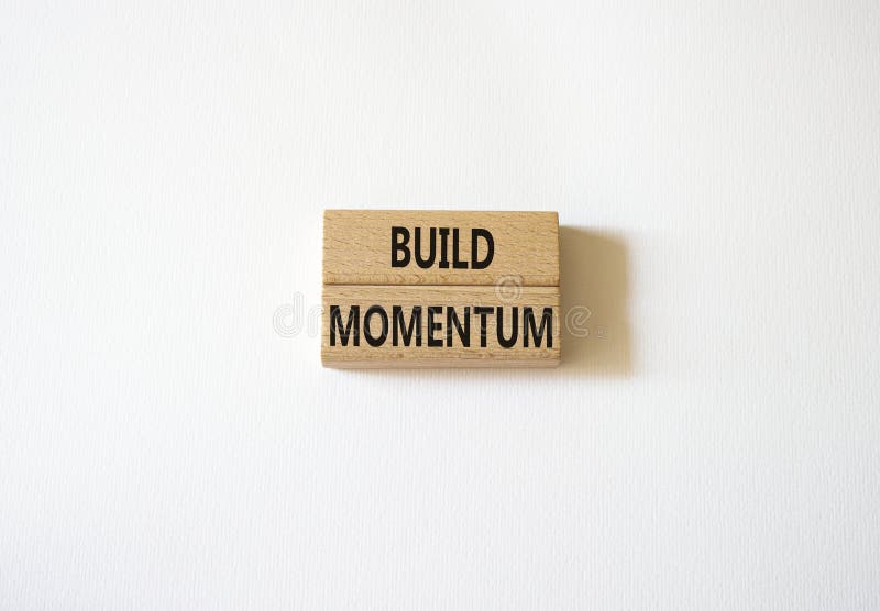 Build momentum symbol. Wooden blocks with words Build momentum. Beautiful white background. Business and Build momentum concept. royalty free stock photos