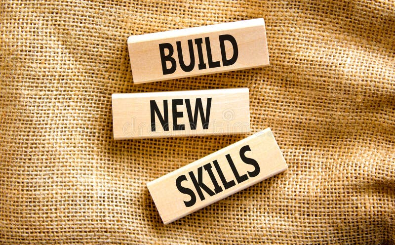 Build new skills symbol. Concept word Build new skills on beautiful wooden block. Beautiful canvas table canvas background. stock image