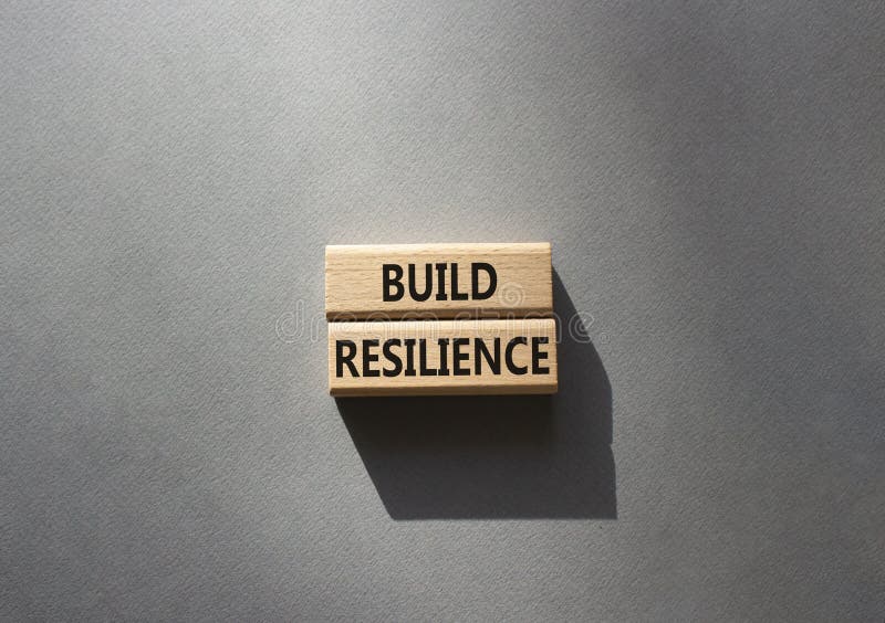 Build resilience symbol. Wooden blocks with words Build resilience. Beautiful grey background. Business and Build resilience royalty free stock image