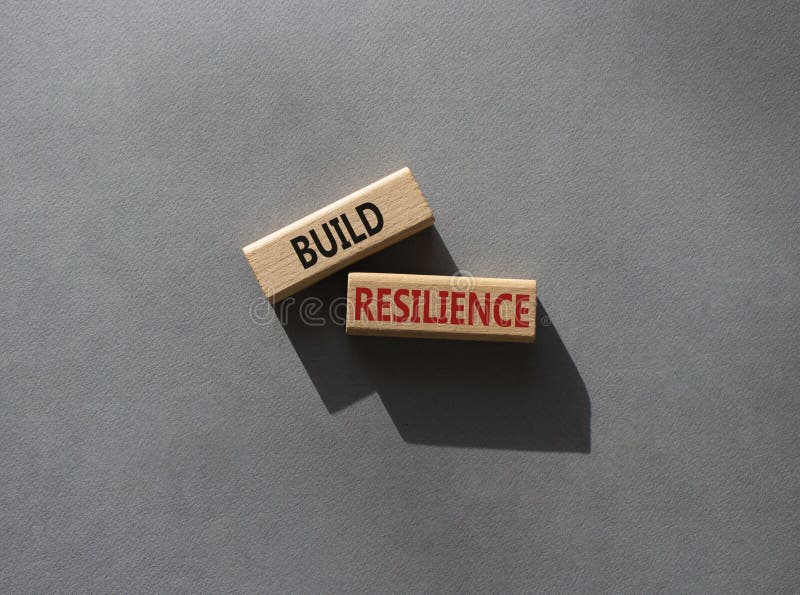 Build resilience symbol. Wooden blocks with words Build resilience. Beautiful grey background. Business and Build resilience royalty free stock image
