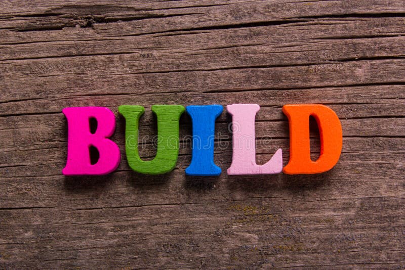 Build word made of wooden letters stock photography