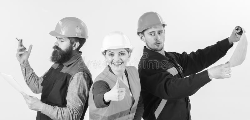 Builder, architect, repairer happy at work. Men and woman in helmets busy with different tasks white