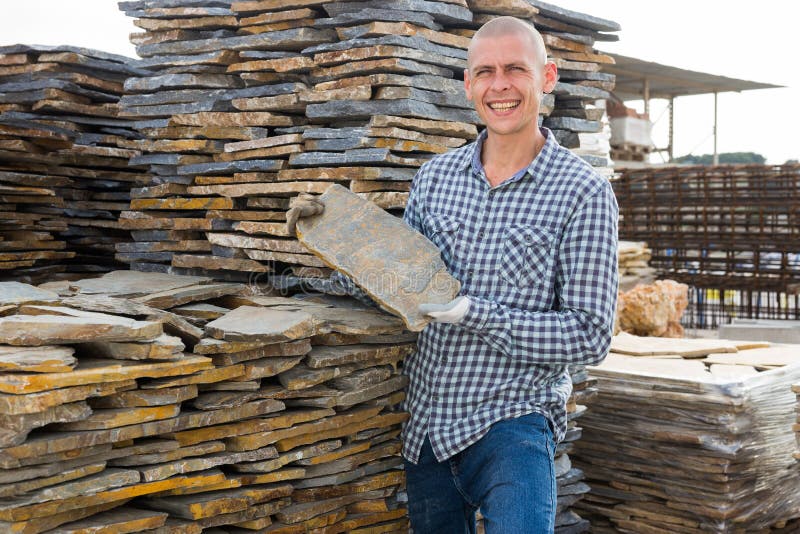 Builder is Choosing Natural Facing Stone in Building Store Stock Photo