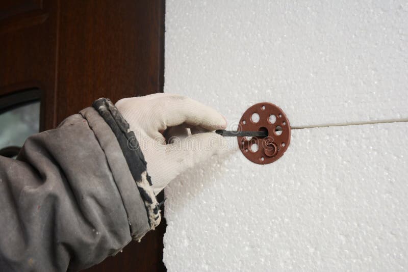 Builder Contractor Installing Rigid Styrofoam Insulation Board with Plastic  Nail for Holding Stock Image - Image of tool, extruded: 142436629