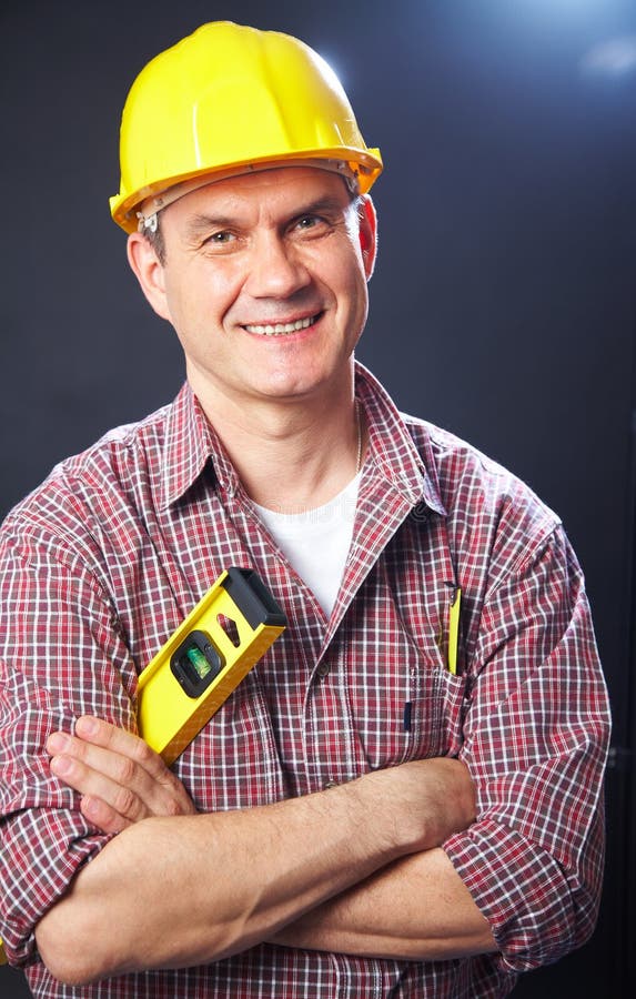 Builder On A Dark Background Stock Image - Image of people, helmet ...