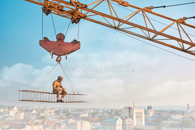 Builder eating and drinking milk on high.