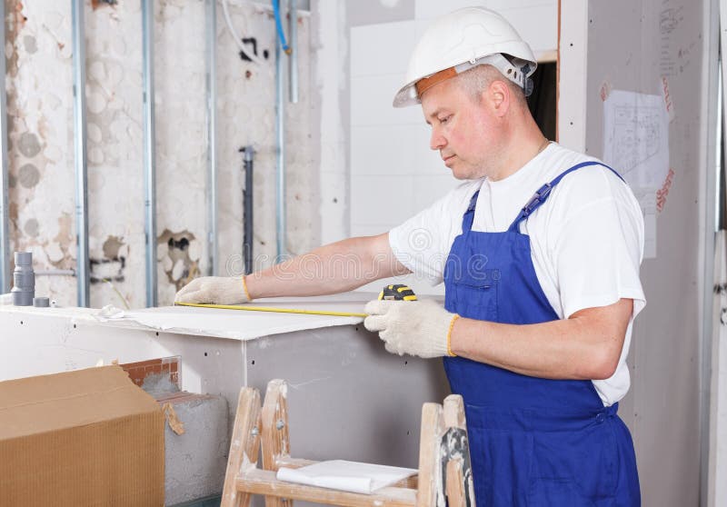 Builder Engaged in Drywall Installation Stock Image Image of adjuster