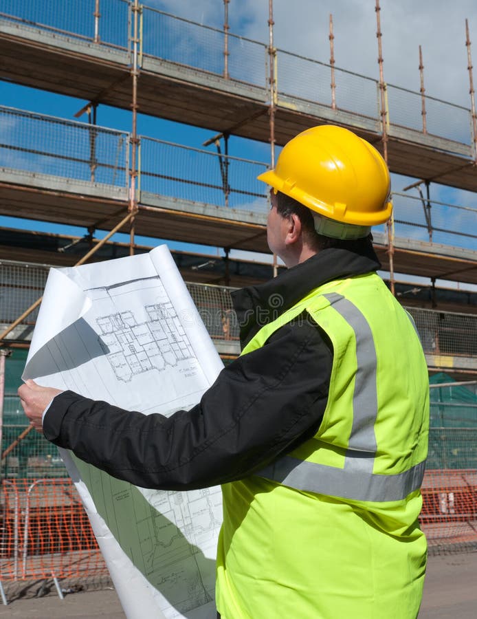 Builder inspects construction site. stock image