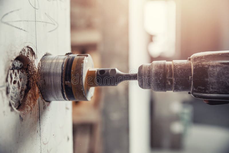 Builder Man Cutting Electrical Chase in Concrete Wall with Groove