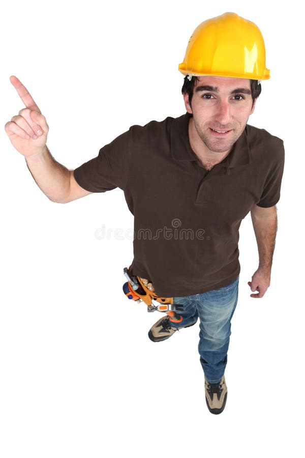 Builder pointing at copyspace royalty free stock photo