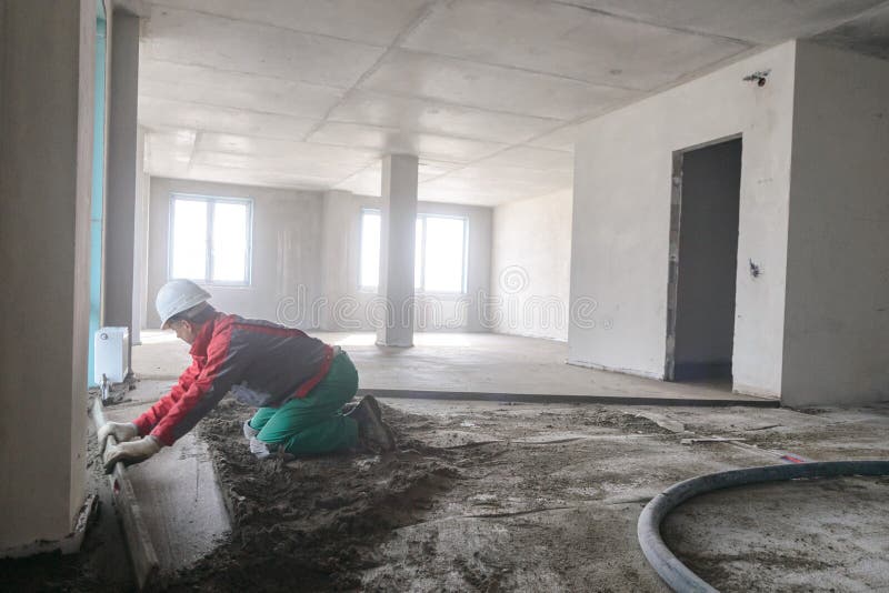 A Builder in Work Clothes is Doing His Job Stock Image Image of