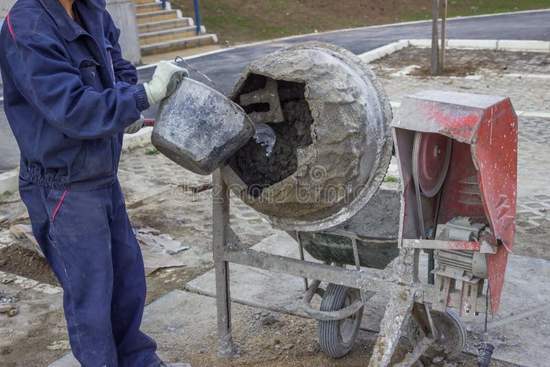 Cement Mixer with Barrel and Plastic Cement Mixing Trough Stock Image
