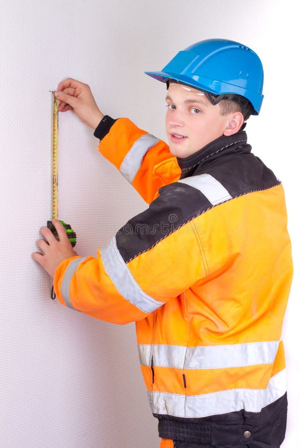 Builder In Working Clothes Measuring Wall Stock Photo - Image of count