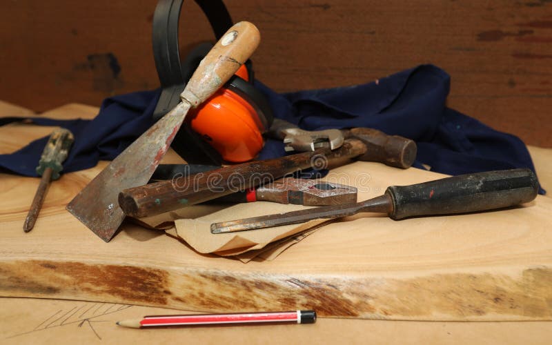 Builders carpenters tools and equipment on a piece of wood