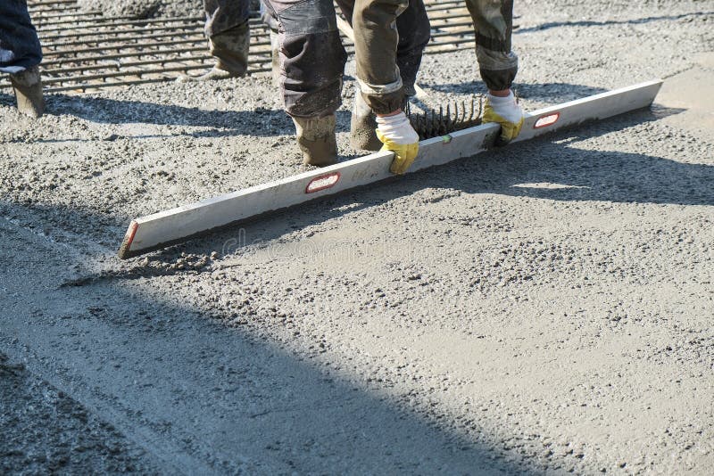 Builders Poured Concrete At The Construction Site Stock