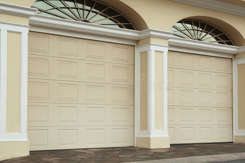 Building with Beige Sectional Garage Doors Outdoors Stock Image Image