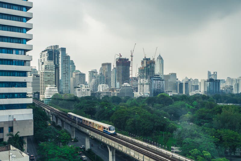 Building in the city with Electric Railway Train in Bangkok Thai