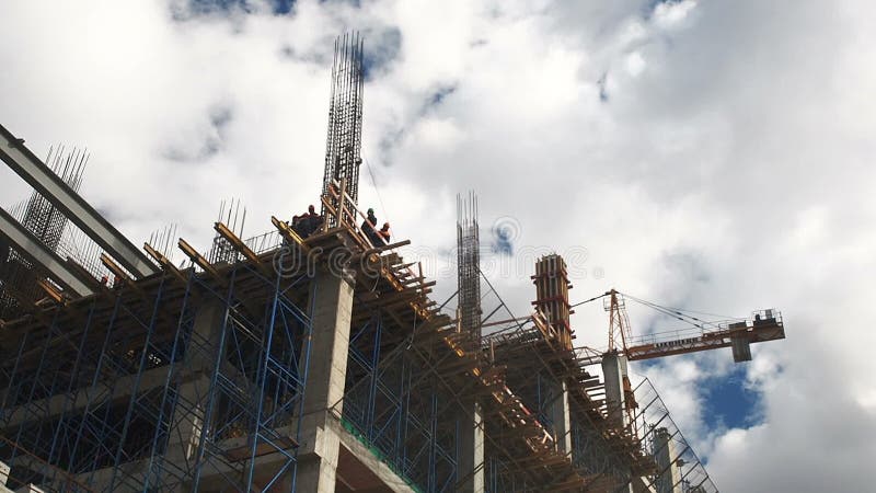 Building construction. Builders are building an apartment house. Residential quarter in the process of construction