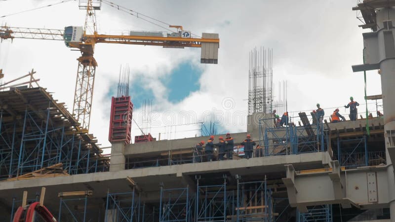 Building construction. Builders are building an apartment house. Residential quarter in the process of construction