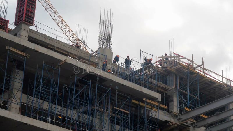 Building construction. Builders are building an apartment house. Residential quarter in the process of construction