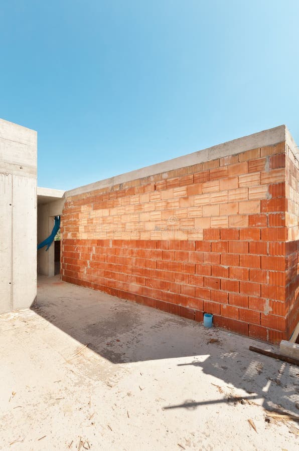 The Foundation of the House with the Basement Walls of Red Brick Stock