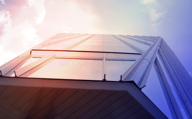 Building a corporate office business low angle. Glass and steel Art Nouveau business district skyscraper. Technological commercial royalty free stock photography Building a corporate office business low angle. Glass and steel Art Nouveau business district skyscraper. Technological commercial royalty free stock photography