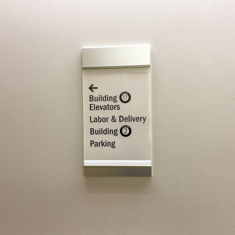 The Building Elevator, Labor and Delivery and Parking Sign for a