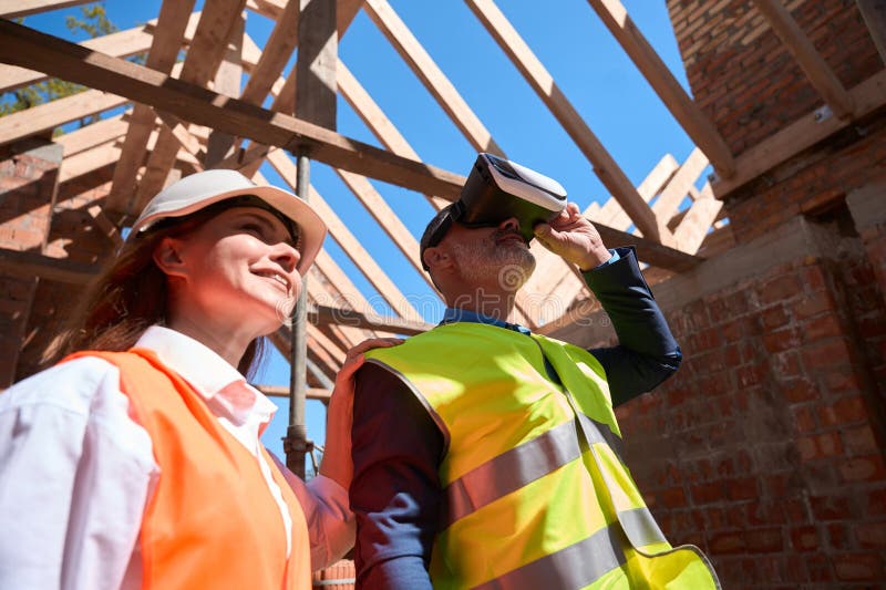 Building Engineers Walking at Construction Site in Virtual Reality