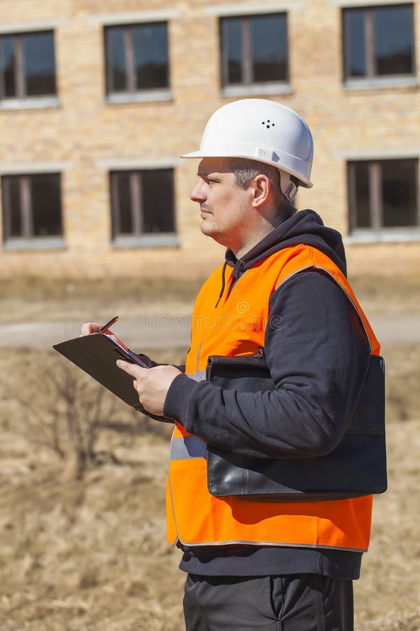 Building inspector with folder stock images