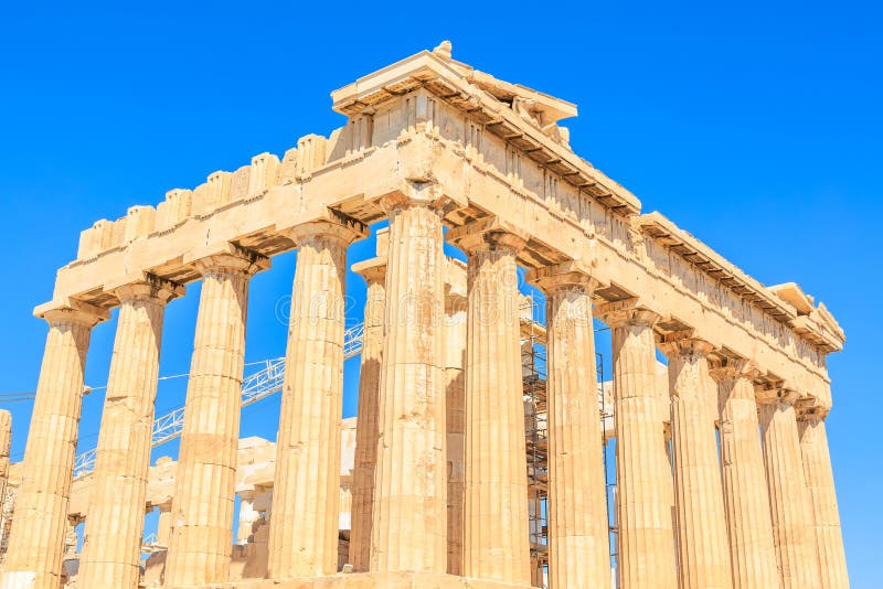 The building is a large, ancient structure with many columns stock photography