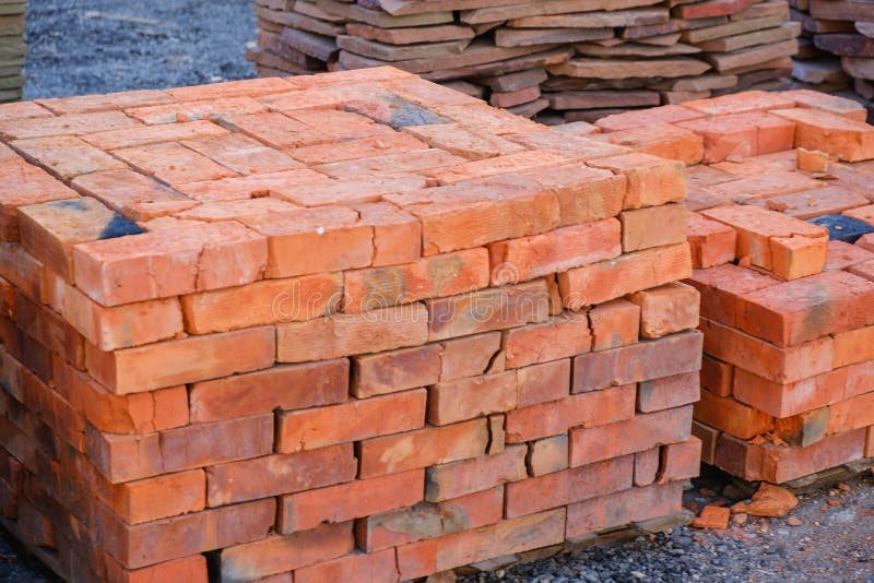 Building Materials, Red Brick on Pallet, a Pile of Bricks, a Background