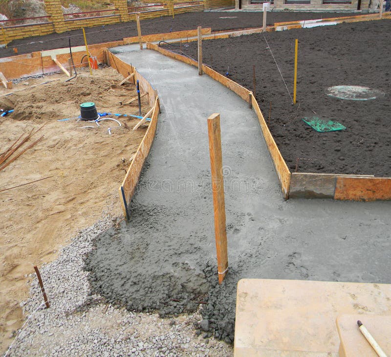 Building new concrete pavement in the garden. stock photo