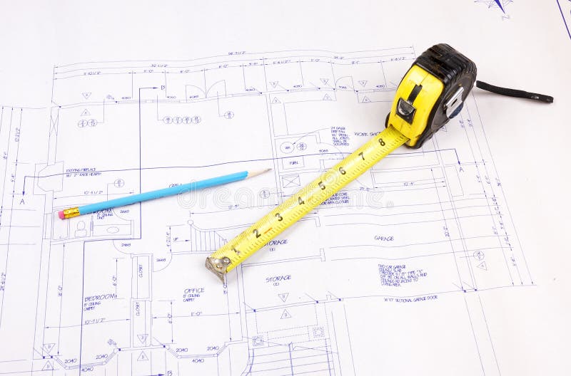 Building plans and tape measure