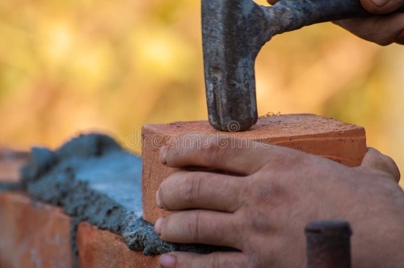 Building a Wall with Red Brick. Working with Bricks for Building a Wall