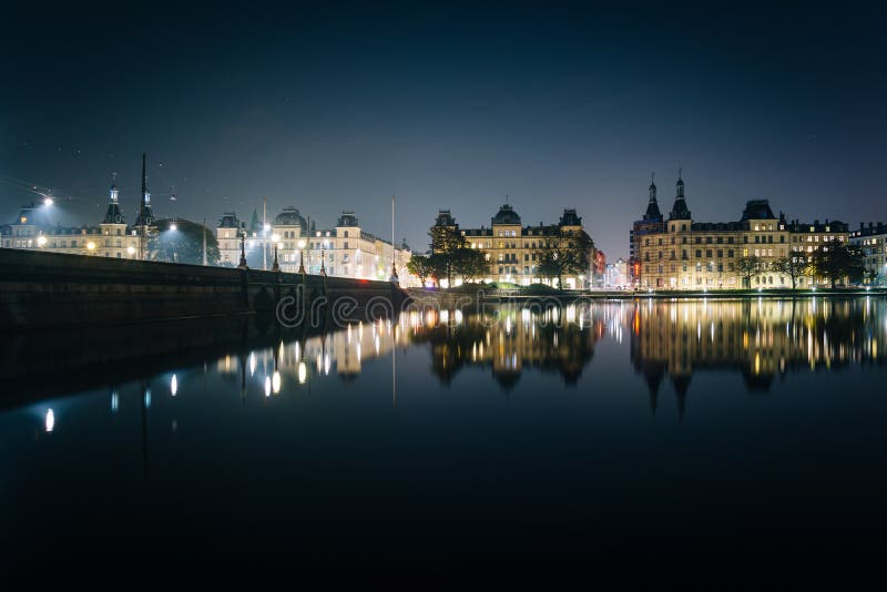 Buildings along Peblinge SÃ¸ at night, in Copenhagen, Denmark.