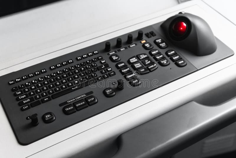Built-in tabletop input device, black industrial keyboard with a trackball royalty free stock photos