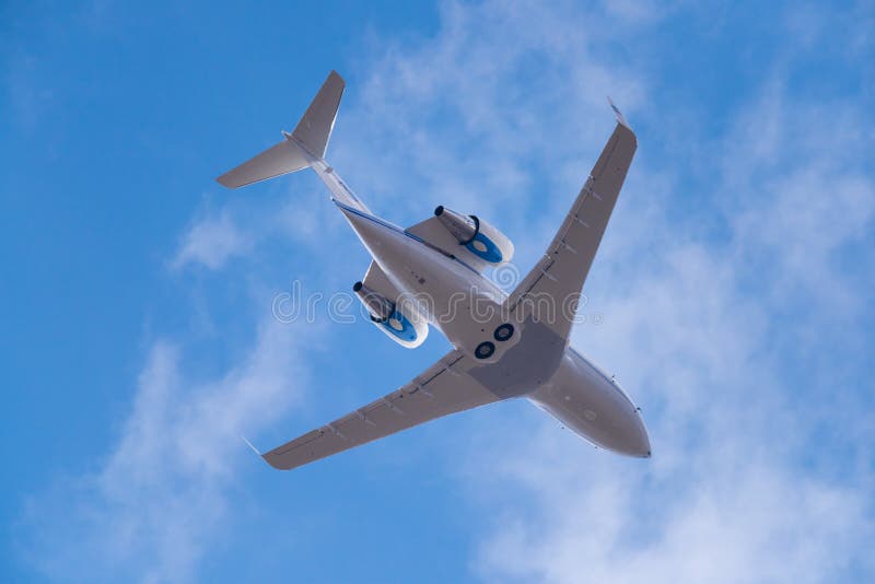 Novosibirsk, Russia - April 27, 2018: Bombardier CL-600-2B16 Challenger 604 Arkasair after takeoff from Tolmachevo International Airport. Novosibirsk, Russia - April 27, 2018: Bombardier CL-600-2B16 Challenger 604 Arkasair after takeoff from Tolmachevo International Airport.