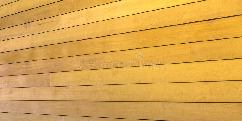 Buiten houten muur met gouden bruine kleur royalty-vrije stock foto Buiten houten muur met gouden bruine kleur royalty-vrije stock foto