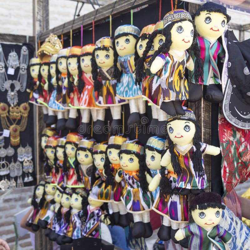 BUKHARA, UZBEKISTAN - MAY 25, 2018: Silk and Spices Festival 2018. Dolls dressed in traditional uzbek costumes. Traditional souven stock photography BUKHARA, UZBEKISTAN - MAY 25, 2018: Silk and Spices Festival 2018. Dolls dressed in traditional uzbek costumes. Traditional souven stock photography