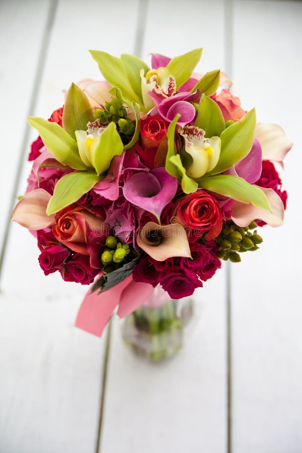 Bright flower bouquet on wooden table. Bright flower bouquet on wooden table.